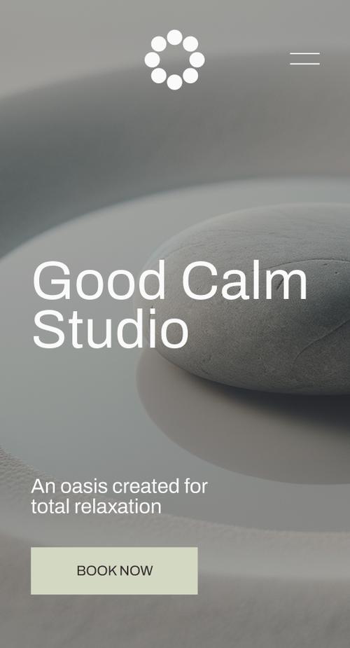 A minimalist spa website homepage featuring a large smooth grey stone photographed against a soft grey background. The page includes a logo in the top left, navigation menu (Services, About, Contact) in the top right, and the spa name ’Good Calm Studio’ in large text. Below is the tagline ’An oasis created for total relaxation’ and a ’BOOK NOW’ button. The overall design conveys calm and serenity.